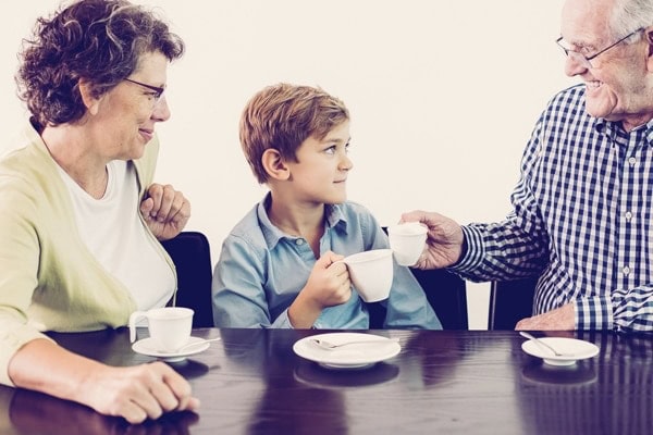 Grandson and Grandparents Drinking Hot Chocolate