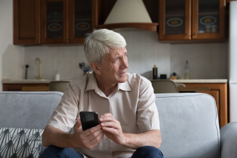 What’s That Smell Coming From My Furnace? Worried senior smartphone user getting bad